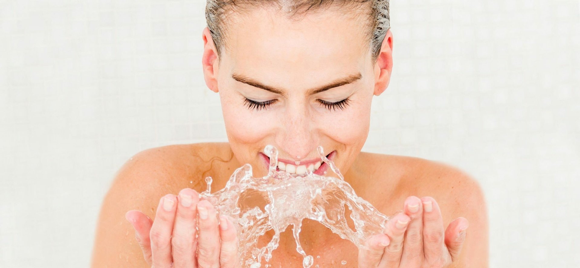 Woman washing her face scaled