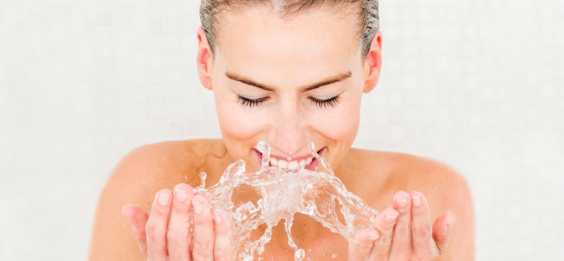 Woman washing her face