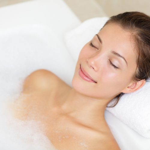 Bathing,Woman,Relaxing,In,Bath,Smiling,Relaxing,With,Eyes,Closed.