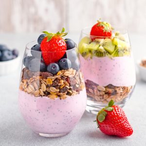 Chia,Seeds,Pudding,With,Granola,,Blueberry,And,Strawberry,In,Glasses.