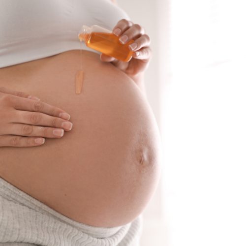 Young,Pregnant,Woman,With,Cosmetic,Product,Indoors,,Closeup.,Space,For
