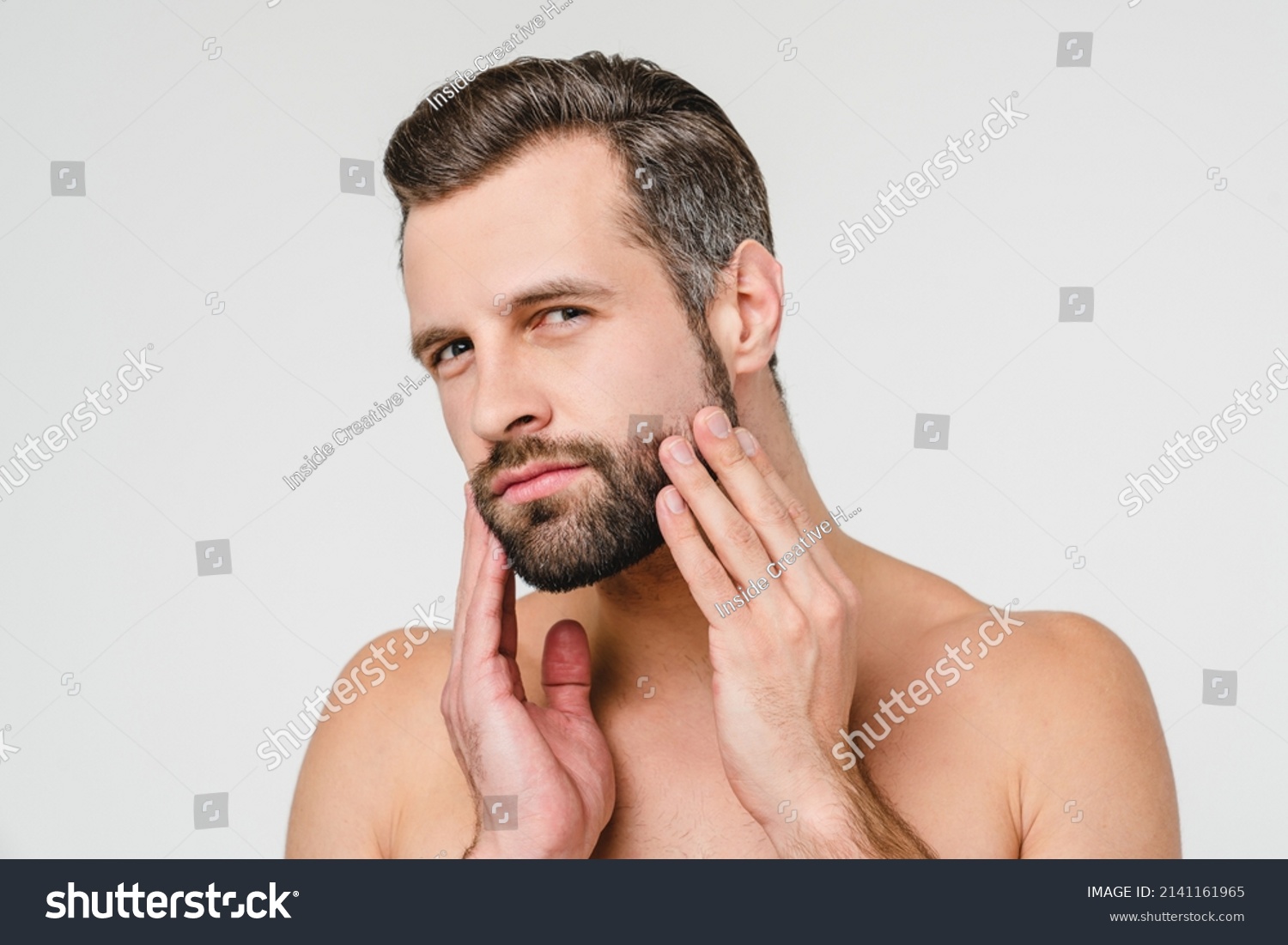 stock-photo-aftershave-cosmetics-caucasian-young-naked-shirtless-man -preparing-for-shaving-with-razor-touching-2141161965