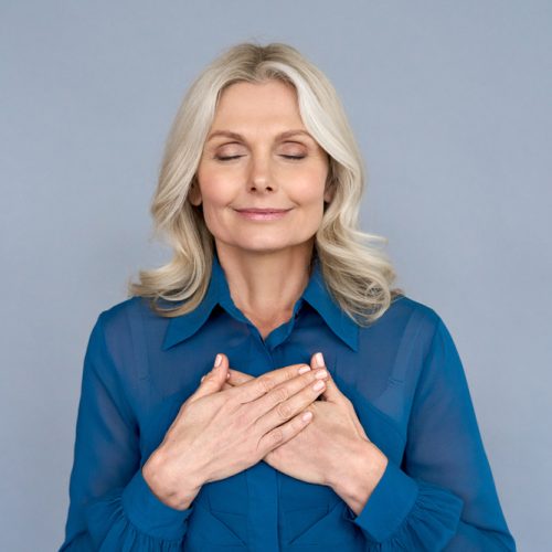Happy,Mindful,Thankful,Middle,Aged,Old,Woman,Holding,Hands,On