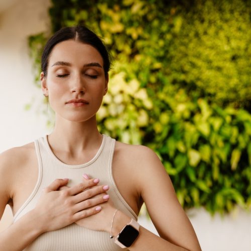Young,White,Woman,Doing,Breathing,Practice,During,Meditation,Indoors