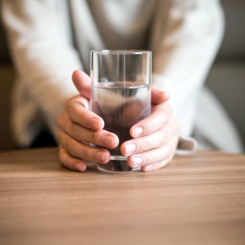Woman,Holding,A,Glass,Of,The,Water