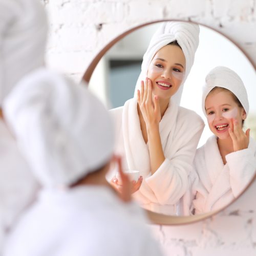Smiling,Young,Woman,And,Little,Daughter,In,White,Bathrobes,And