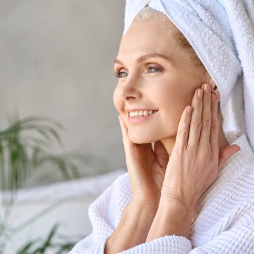 Happy,Smiling,Gorgeous,Middle,Aged,Woman,Wearing,Bathrobe,And,White